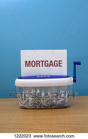 The word 'Mortgage' about to be shredded View Large Photo Image Stock Image - The word 'Mortgage' about to be shredded. Fotosearch
