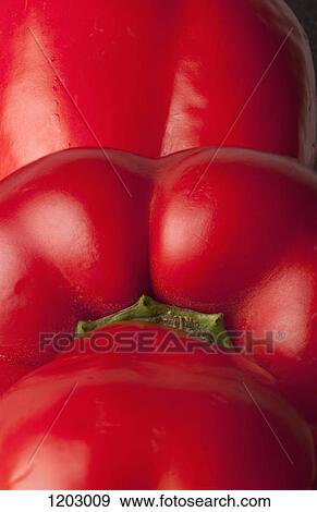 Three red bell peppers arranged in a row View Large Photo Image Stock Photo - Three red bell peppers arranged in a row. Fotosearch