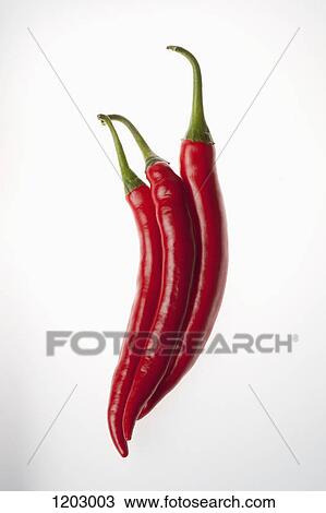 Three red chili peppers touching, in a row View Large Photo Image Stock Image - Three red chili peppers touching, in a row. Fotosearch