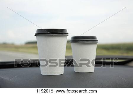 Two disposable cups of coffee on a car dashboard View Large Photo Image Stock Photography - Two disposable cups of coffee on a car dashboard. Fotosearch