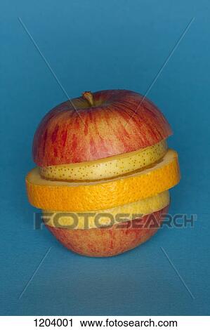 Stock Image - Uneven slices of different fruit stacked to comprise the shape of a piece of fruit. Fotosearch