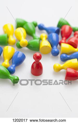 Upright game piece amongst many knocked down game pieces View Large Photo Image Stock Photo - Upright game piece amongst many knocked down game pieces. Fotosearch