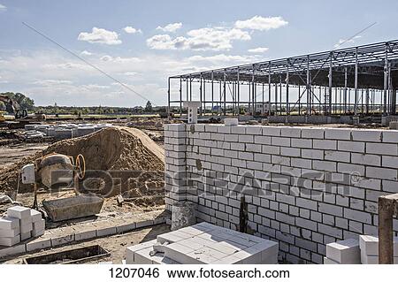 Stock Photograph - Wall building materials at construction site. Fotosearch