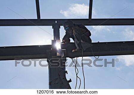 Stock Photograph - Welder on high beam. Fotosearch