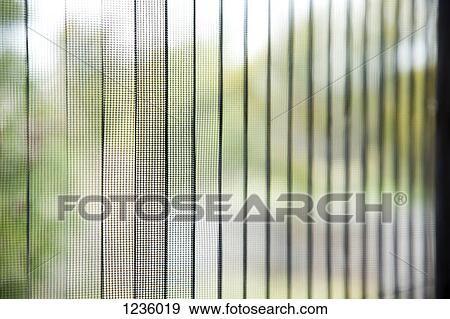 A blurred scene view through transparent textile curtains View Large Photo Image Stock Photo - A blurred scene view through transparent textile curtains. Fotosearch