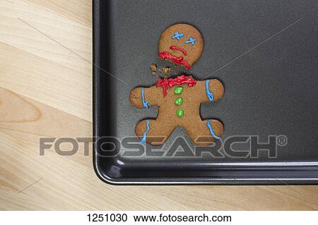 A decapitated gingerbread man on a baking sheet View Large Photo Image Stock Image - A decapitated gingerbread man on a baking sheet. Fotosearch