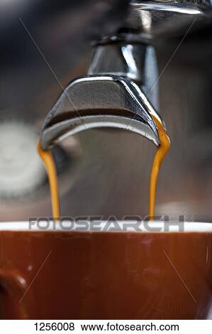 A double shot of espresso being poured from an espresso maker View Large Photo Image Stock Photo - A double shot of espresso being poured from an espresso maker. Fotosearch