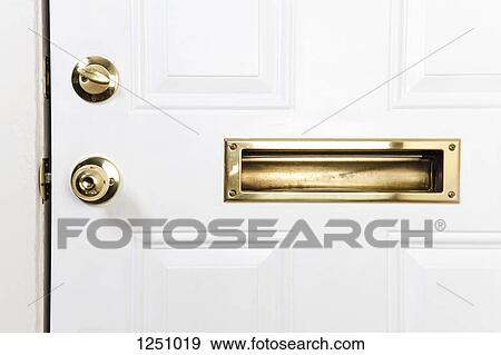 A front door with mail slot, doorknob and deadbolt lock View Large Photo Image Stock Photo - A front door with mail slot, doorknob and deadbolt lock. Fotosearch