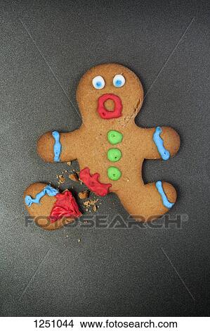 A gingerbread man looking shocked with a broken leg View Large Photo Image Picture - A gingerbread man looking shocked with a broken leg . Fotosearch