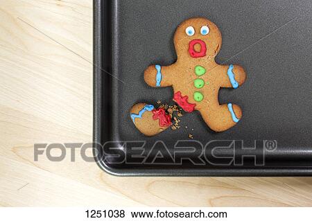 A gingerbread man looking shocked with a broken leg View Large Photo Image Stock Photo - A gingerbread man looking shocked with a broken leg . Fotosearch