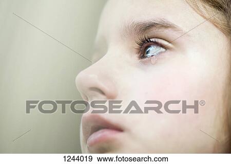 A girl shedding a tear View Large Photo Image Stock Photo - A girl shedding a tear. Fotosearch