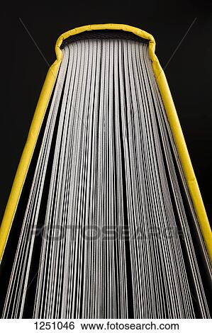 Stock Photograph - A hardcover book with fanned out pages, close-up. Fotosearch