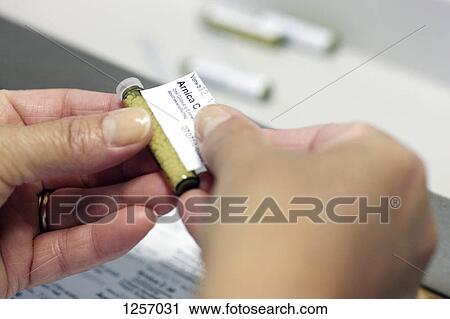 A homeopathic prescription of Arnica, which is a perennial herb View Large Photo Image Stock Image - A homeopathic prescription of Arnica, which is a perennial herb . Fotosearch