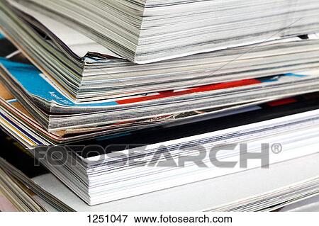 A messy stack of various magazines, close-up, full frame View Large Photo Image Stock Photo - A messy stack of various magazines, close-up, full frame. Fotosearch