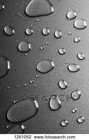 A pattern of various shaped water drops on a nonstick baking sheet View Large Photo Image Stock Image - A pattern of various shaped water drops on a nonstick baking sheet. Fotosearch