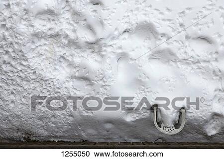 A plastic lawn chair buried in snow in a backyard View Large Photo Image Stock Image - A plastic lawn chair buried in snow in a backyard. Fotosearch