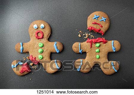 A shocked gingerbread man with broken leg next to a decapitated gingerbread man View Large Photo Image Picture - A shocked gingerbread man with broken leg next to a decapitated gingerbread man. Fotosearch