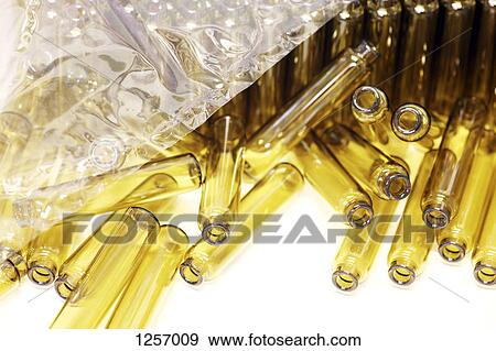 Stock Photo - A stack of new small vials. Fotosearch