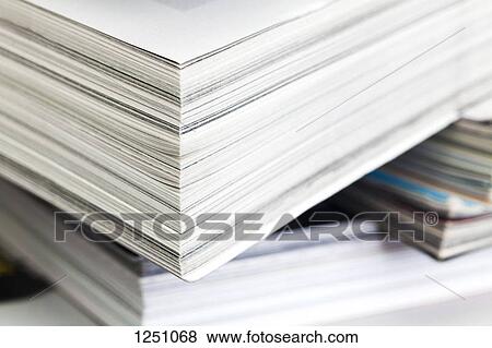 Stock Photo - A stack of various magazines, full frame. Fotosearch