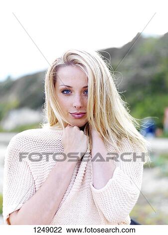 A teenage girl at the beach with a playfully flirtatious look on her face View Large Photo Image Stock Image - A teenage girl at the beach with a playfully flirtatious look on her face. Fotosearch