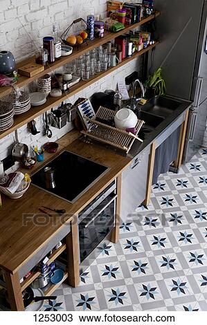 A tidy domestic kitchen with flooring that has a star shaped pattern View Large Photo Image Stock Image - A tidy domestic kitchen with flooring that has a star shaped pattern. Fotosearch
