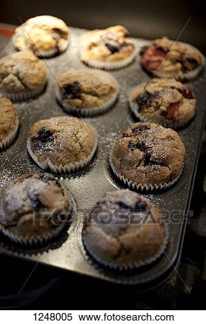 A tray of baked raspberry muffins View Large Photo Image Stock Photography - A tray of baked raspberry muffins. Fotosearch