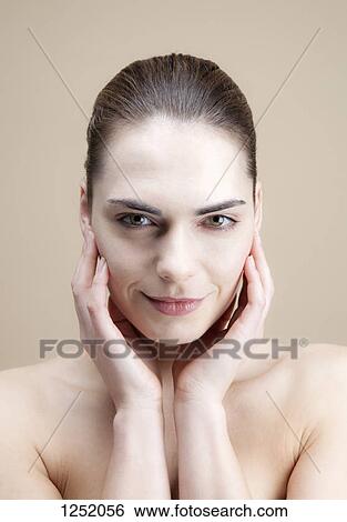 A young woman looking sensually at the camera View Large Photo Image Stock Photograph - A young woman looking sensually at the camera. Fotosearch