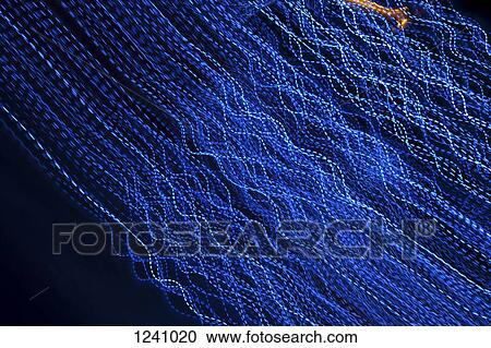 Abstract blue lines against a black background View Large Photo Image Stock Image - Abstract blue lines against a black background. Fotosearch