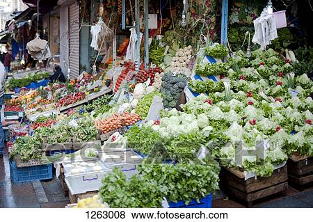 An abundance of vegetables at an outdoor farmer's market View Large Photo Image Stock Photo - An abundance of vegetables at an outdoor farmer's market. Fotosearch