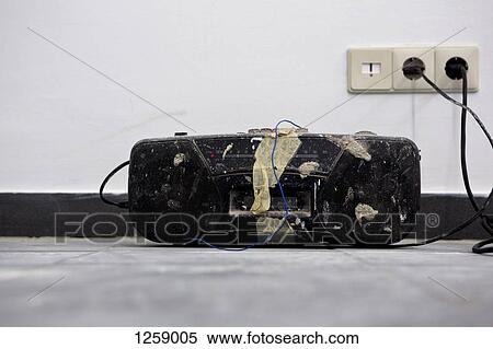 An old battered boom box plugged into a wall View Large Photo Image Stock Photography - An old battered boom box plugged into a wall. Fotosearch