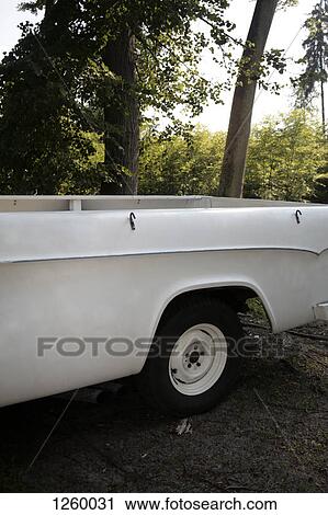 An old-fashioned pickup truck parked in a natural scene View Large Photo Image Stock Image - An old-fashioned pickup truck parked in a natural scene. Fotosearch