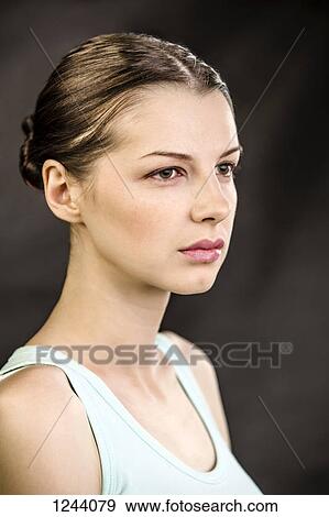 Stock Photo - Beautiful woman looking away. Fotosearch
