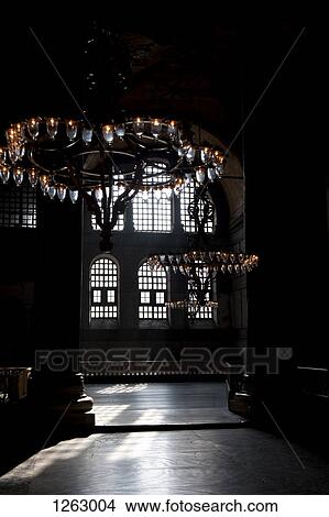 Chandeliers hanging in a shadowed interior of the Blue Mosque, Istanbul, Turkey View Large Photo Image Picture - Chandeliers hanging in a shadowed interior of the Blue Mosque, Istanbul, Turkey. Fotosearch