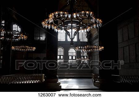Chandeliers hanging in a shadowed interior of the Blue Mosque, Istanbul, Turkey View Large Photo Image Stock Photo - Chandeliers hanging in a shadowed interior of the Blue Mosque, Istanbul, Turkey. Fotosearch