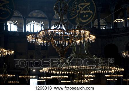 Chandeliers hanging in the Blue Mosque, gold Arabic script in background, Istanbul, Turkey View Large Photo Image Stock Image - Chandeliers hanging in the Blue Mosque, gold Arabic script in background, Istanbul, Turkey. Fotosearch