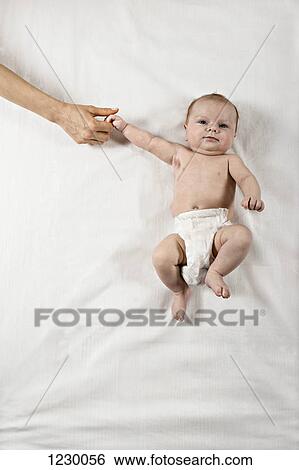 Stock Photograph - Child holding mother's hand. Fotosearch
