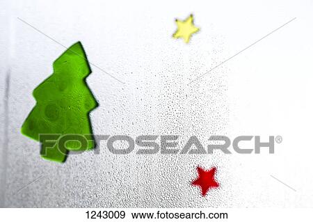 Christmas decals on a window with condensation on it, close-up View Large Photo Image Stock Photo - Christmas decals on a window with condensation on it, close-up. Fotosearch