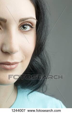 Close up of beautiful woman looking at camera View Large Photo Image Stock Photo - Close up of beautiful woman looking at camera. Fotosearch