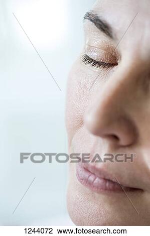 Close-up of woman napping View Large Photo Image Stock Image - Close-up of woman napping. Fotosearch