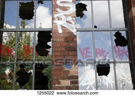 Detail of a building with broken windows and graffiti View Large Photo Image Stock Image - Detail of a building with broken windows and graffiti. Fotosearch