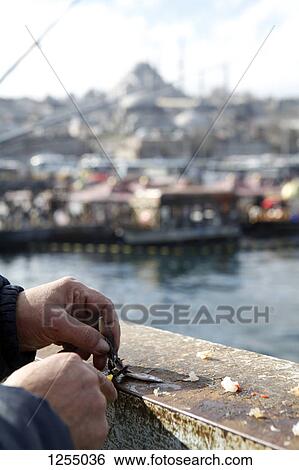 Detail of a fisherman on Galata Bridge, Istanbul, Turkey View Large Photo Image Stock Photograph - Detail of a fisherman on Galata Bridge, Istanbul, Turkey. Fotosearch