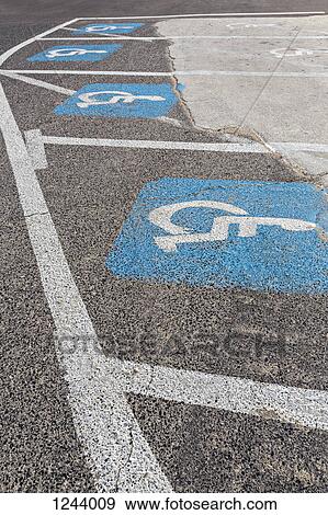 Disabled parking spaces on tarmac road View Large Photo Image Stock Photo - Disabled parking spaces on tarmac road. Fotosearch