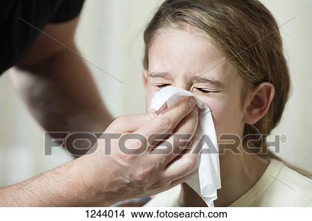 Father wiping daughter's nose with tissue View Large Photo Image Picture - Father wiping daughter's nose with tissue. Fotosearch