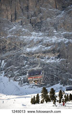Four people in a ski lift View Large Photo Image Stock Image - Four people in a ski lift. Fotosearch