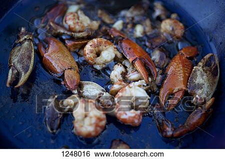 Freshwater Yabby claws and prawns in cooking oil in pan View Large Photo Image Stock Photograph - Freshwater Yabby claws and prawns in cooking oil in pan. Fotosearch