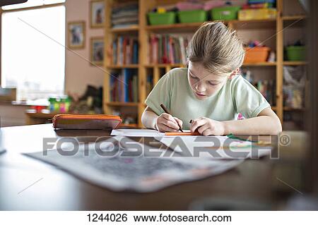 Girl doing her homework View Large Photo Image Stock Photograph - Girl doing her homework. Fotosearch