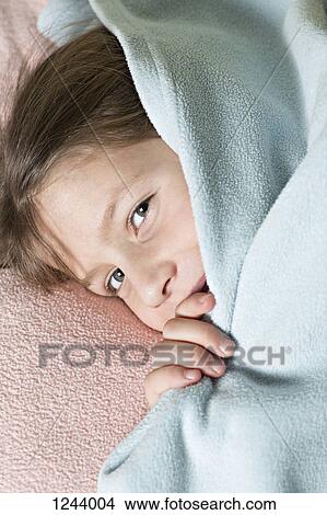 Girl under blanket View Large Photo Image Picture - Girl under blanket. Fotosearch