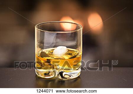 Glass of whiskey and ice View Large Photo Image Stock Image - Glass of whiskey and ice. Fotosearch