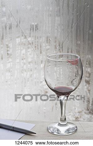 Lipstick stained wine glass beside pen and paper View Large Photo Image Stock Photography - Lipstick stained wine glass beside pen and paper. Fotosearch
