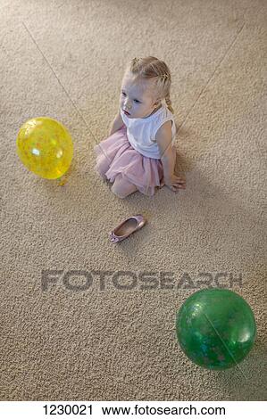 Little girl between two balloons as her ballet shoe lies on the floor View Large Photo Image Stock Image - Little girl between two balloons as her ballet shoe lies on the floor. Fotosearch
